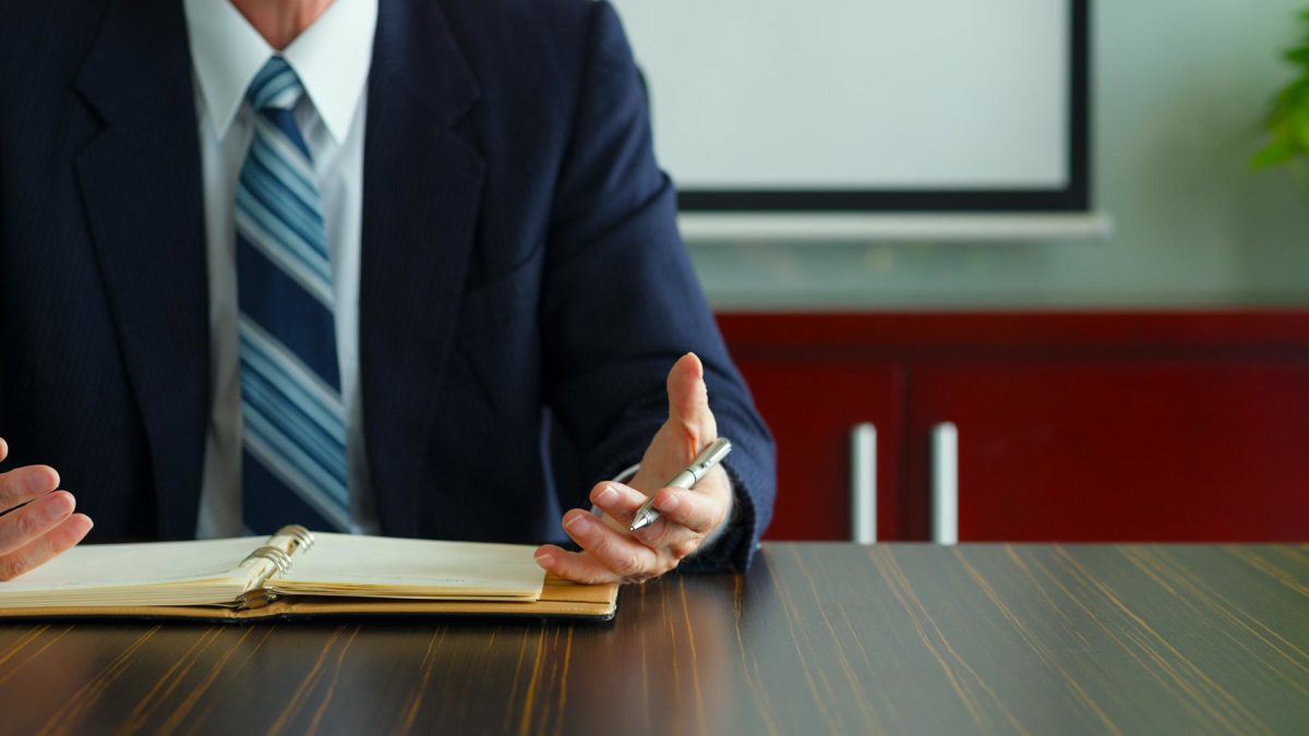 man discussing funeral insurance in an office in Burbank